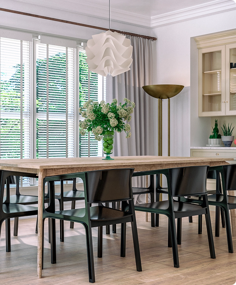 Modern dining room with wooden table and black chairs.