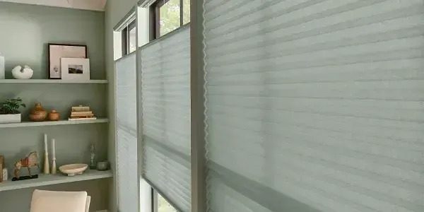 A window with white blinds on the outside of it.