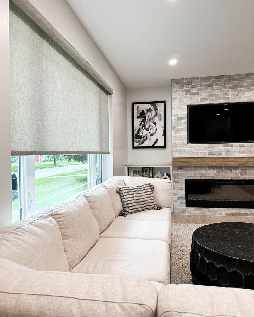 A living room with a couch and fireplace